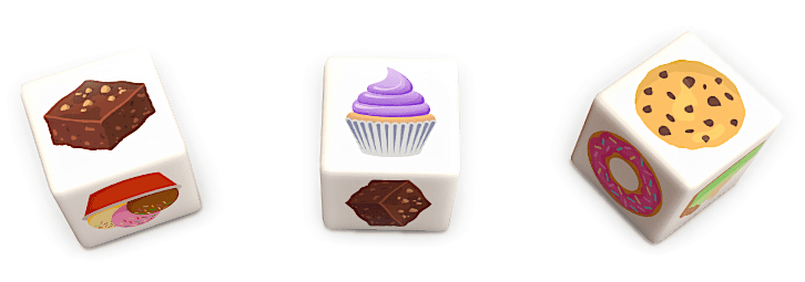 Three dessert dice, showing a roll of brownies, cupcakes, and cookies.
